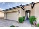 Attractive single-story home featuring desert landscaping and an attached two-car garage at 9537 Wild Valley Ave, Las Vegas, NV 89148