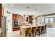 Open kitchen with granite counters, stainless appliances, and eat-in island with seating at 9537 Wild Valley Ave, Las Vegas, NV 89148