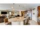Kitchen with an island featuring a granite countertop, sink, and wooden cabinets at 9537 Wild Valley Ave, Las Vegas, NV 89148