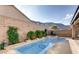 Backyard view of pool and mountain, lush landscape providing a refreshing oasis and outdoor living at 9537 Wild Valley Ave, Las Vegas, NV 89148