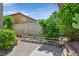 A tranquil backyard featuring lush greenery and a well-maintained fence at 9746 Driftwood Island Ct, Las Vegas, NV 89148