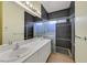 Contemporary bathroom with double sinks and modern shower at 9746 Driftwood Island Ct, Las Vegas, NV 89148