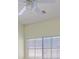 Bedroom with a ceiling fan and window providing natural light at 9746 Driftwood Island Ct, Las Vegas, NV 89148