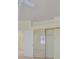 Bedroom featuring a closet with sliding doors and a window providing natural light at 9746 Driftwood Island Ct, Las Vegas, NV 89148