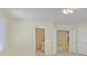 Spacious bedroom featuring neutral carpeting, ceiling fan, and multiple doorways at 9746 Driftwood Island Ct, Las Vegas, NV 89148