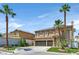 Inviting two-story home featuring well-maintained landscaping and an attached three-car garage at 9746 Driftwood Island Ct, Las Vegas, NV 89148