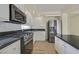 Well-equipped kitchen featuring granite countertops and stainless steel appliances at 9746 Driftwood Island Ct, Las Vegas, NV 89148