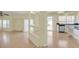 Open-concept living space leading to kitchen and outdoor patio, perfect for entertaining at 9746 Driftwood Island Ct, Las Vegas, NV 89148