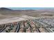 An aerial view displaying the property in its surrounding community with mountainous landscape at , Henderson, NV 89044