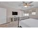 Comfortable bedroom with ceiling fan, window and cabinet with glass doors at , Henderson, NV 89044