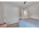 Cozy bedroom featuring a closet and a colorful floral comforter at , Henderson, NV 89044