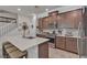 Modern kitchen features stainless steel appliances, a center island with seating, and beautiful tile flooring at , Henderson, NV 89044