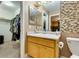 Bathroom with mosaic tiles, white vanity, and large closet space at , Las Vegas, NV 89145
