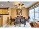 Dining area with wood table, ceiling fan, and backyard view at , Las Vegas, NV 89145