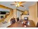 Bright dining area featuring a wood table, a ceiling fan, and stairs to the second floor at , Las Vegas, NV 89145
