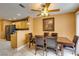 The dining area features wood table and a view to the kitchen with stainless steel refrigerator at , Las Vegas, NV 89145