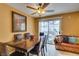 Dining room with a wood table, ceiling fan, and sliding glass doors at , Las Vegas, NV 89145