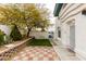 Two-story townhome featuring a private entry courtyard with green grass at , Las Vegas, NV 89145