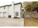 White two-story townhome with a private fenced courtyard area at , Las Vegas, NV 89145