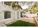Exterior view of the home's entrance, featuring a tiled patio and green grass at , Las Vegas, NV 89145