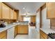 Open kitchen with tile floors leading into a living room with a ceiling fan at , Las Vegas, NV 89145