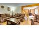 Open-concept living room showing leather furniture, a staircase, and view into the dining area at , Las Vegas, NV 89145