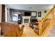 Inviting living room with a cozy fireplace, wood floors, and staircase to the second level at , Las Vegas, NV 89145