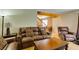 Comfortable living room featuring leather armchairs and sofas, bright lighting, and warm tones at , Las Vegas, NV 89145