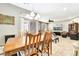 Elegant dining area featuring an over-sized table and chairs with easy access to living areas at 10247 Jamapa Dr, Las Vegas, NV 89178