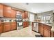 Well-equipped kitchen with stainless steel appliances, granite countertops, and ample cabinetry at 10247 Jamapa Dr, Las Vegas, NV 89178