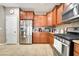 Modern kitchen features stainless steel appliances, tile floors, and granite countertops at 10247 Jamapa Dr, Las Vegas, NV 89178