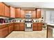 Traditional kitchen with granite counters, stainless appliances, and ample storage at 10247 Jamapa Dr, Las Vegas, NV 89178