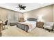 Comfortable main bedroom with neutral tones, a ceiling fan, and carpeted floors at 10247 Jamapa Dr, Las Vegas, NV 89178
