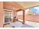 Cozy covered patio with pavers and a view of the backyard, perfect for outdoor relaxation and entertaining at 10247 Jamapa Dr, Las Vegas, NV 89178