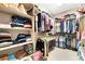 Spacious walk-in closet with built-in shelving and rods, providing ample storage space for clothes and accessories at 10247 Jamapa Dr, Las Vegas, NV 89178