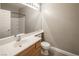 Bathroom with a single vanity, white tile shower, and modern fixtures at 10291 Delta View Ct # 101, Las Vegas, NV 89129