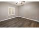 Comfortable bedroom with hardwood floors, natural light, and neutral paint providing a relaxing ambiance at 10291 Delta View Ct # 101, Las Vegas, NV 89129
