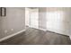 Neutral bedroom features wood-look floors, base trim, and closet with white bi-fold doors at 10291 Delta View Ct # 101, Las Vegas, NV 89129