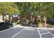 Community clubhouse with lush trees and a parking lot in a well maintained desert community at 10291 Delta View Ct # 101, Las Vegas, NV 89129
