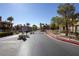 Community gated entrance featuring meticulously landscaped grounds, mature trees, and secured access at 10291 Delta View Ct # 101, Las Vegas, NV 89129