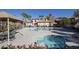 Resort-style pool and hot tub with seating areas, umbrellas, and mountain views on a clear day at 10291 Delta View Ct # 101, Las Vegas, NV 89129