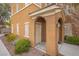Inviting front entrance featuring a covered porch with stylish arches and attractive landscaping at 10291 Delta View Ct # 101, Las Vegas, NV 89129
