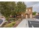 Well-maintained building exterior with manicured landscaping, visible unit numbers, and convenient parking at 10291 Delta View Ct # 101, Las Vegas, NV 89129