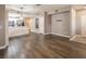 Spacious living room with hardwood floors, neutral paint, and an open floor plan leading to the kitchen at 10291 Delta View Ct # 101, Las Vegas, NV 89129