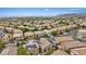 Wide aerial shot of a residential neighborhood showcasing rooftops and community layout on a sunny day at 10680 Sapphire Vista Ave, Las Vegas, NV 89144