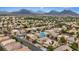 Expansive aerial view of a neighborhood showcasing a community with scenic mountain backdrop and various home styles at 10680 Sapphire Vista Ave, Las Vegas, NV 89144