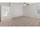 Spacious bedroom with plush carpeting, ceiling fan, and lots of natural light at 10680 Sapphire Vista Ave, Las Vegas, NV 89144