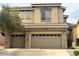 Charming two-story home featuring a tile roof, stucco siding, and a three-car garage at 10680 Sapphire Vista Ave, Las Vegas, NV 89144
