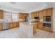 Spacious kitchen with stainless steel appliances, a center island, and plenty of cabinet space at 10680 Sapphire Vista Ave, Las Vegas, NV 89144