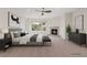Serene main bedroom with a fireplace, soft lighting, and a calm color palette, designed for rest and comfort at 10680 Sapphire Vista Ave, Las Vegas, NV 89144
